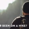 an image of a hiker conducting their own "business process review" overlooking a mountain range