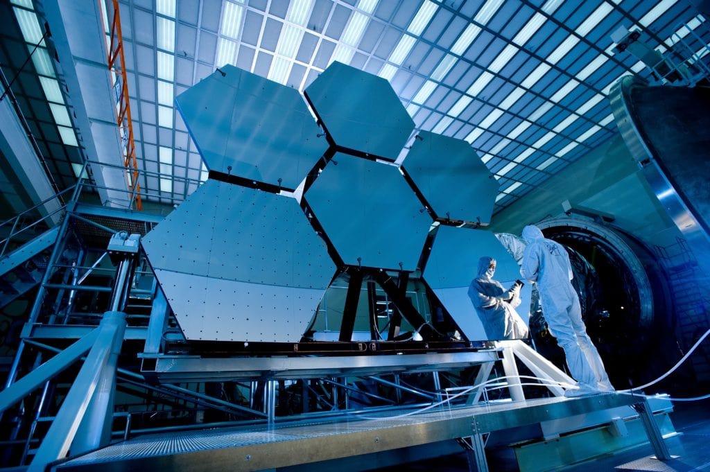 A picture of a technician with clipboard inspecting equipment. industry 4.0 presents opportunities for more specialized jobs and more sustainable job growth.