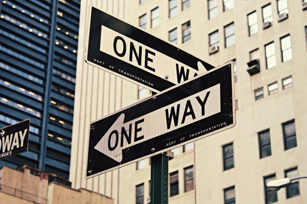 an image of signage indicating multiple one-way direction traffic