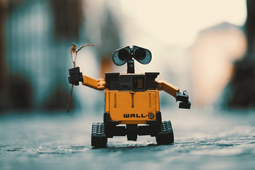 a picture of Disney robot character wall-e holding up a plant in one hand. industry Automation in industry 4.0 brings robots into manufacturing like never before.