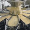 a photo of grain sorting machinery in a food processing plant. - encompass solutions.