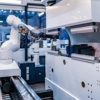 an image of robotic arm automated production in industrial automation which can be used to leverage a digital twin in an ERP production environment simulation