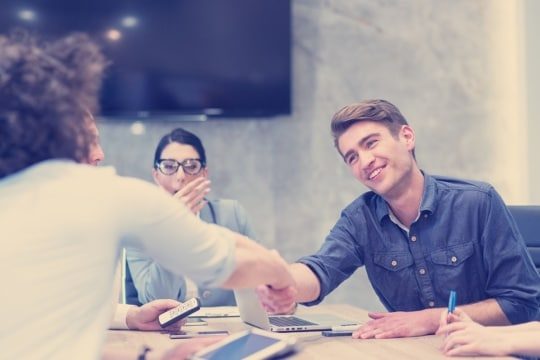 an image of a business owner and edi partner agreeing on an edi for small businesses contract