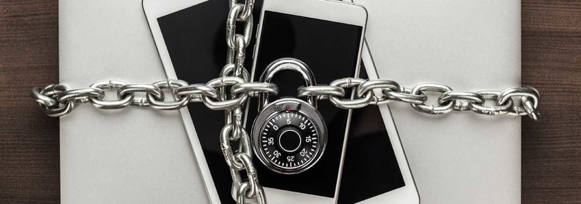 an image of computers, phones, and tablets under lock and key as part of 7 simple ways to keep your data safe