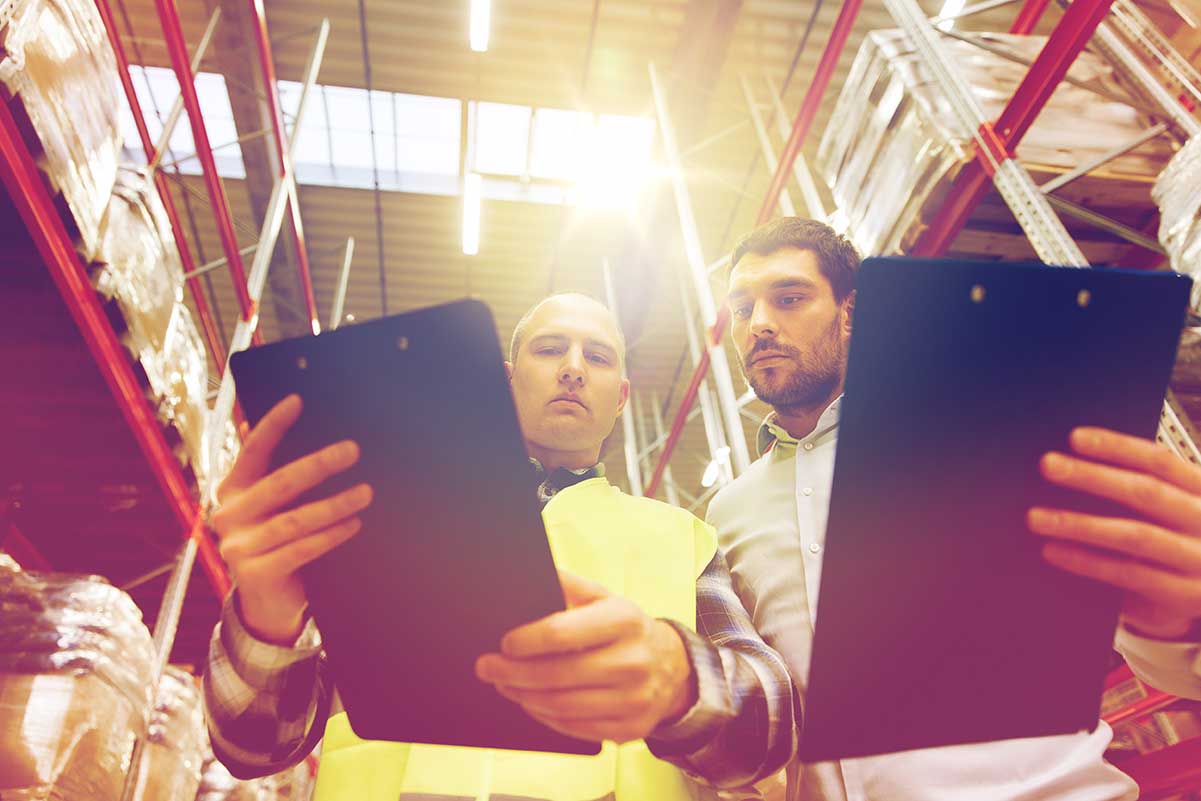 an image of two warehouse management workers as part of ERP Supply Chain Management solutions