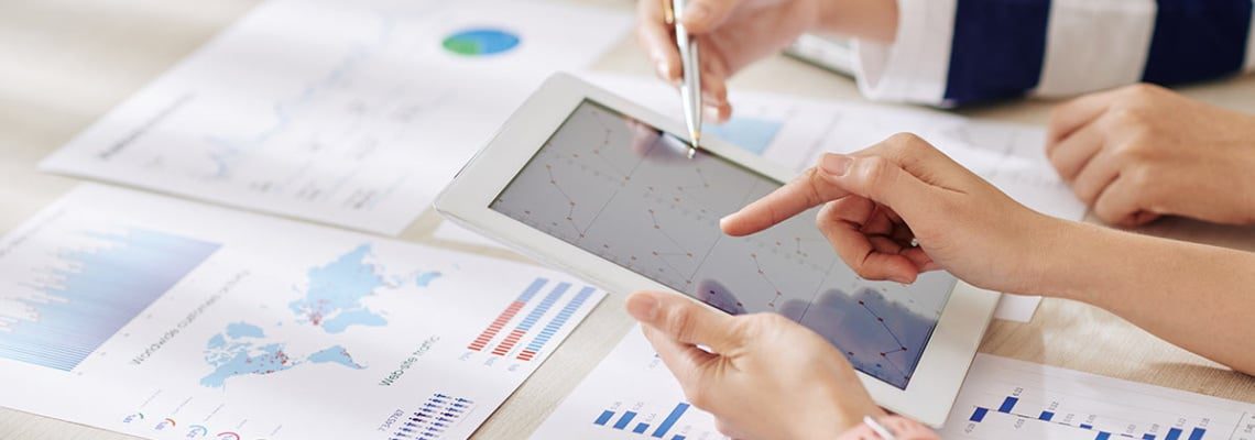 an image of employees using epicor advanced financial reporting tools