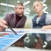 an image of business people measuring business success throguh the use of epicor data analytics