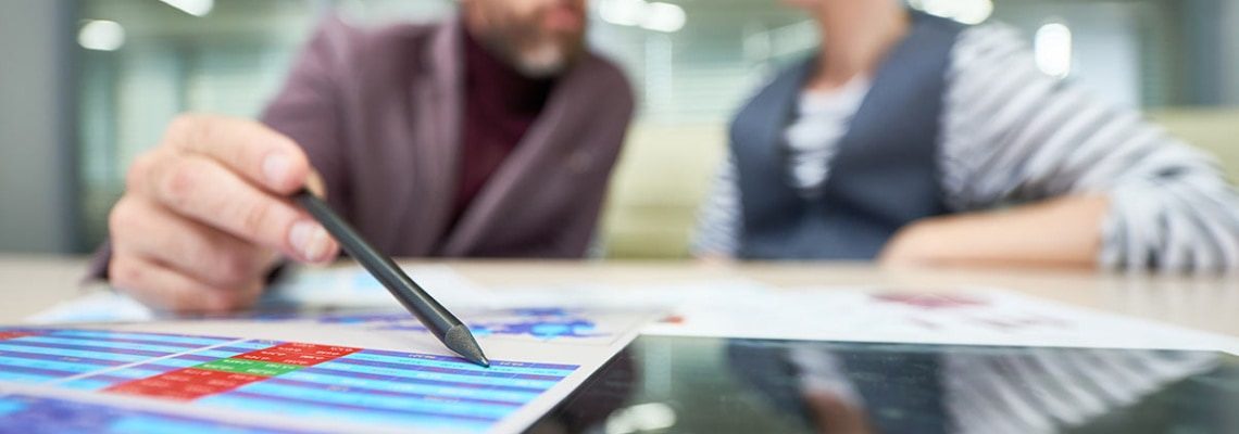 an image of business people measuring business success throguh the use of epicor data analytics