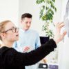 two coworkers designing a business improvement project