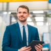 business man with tablet in manufacturing