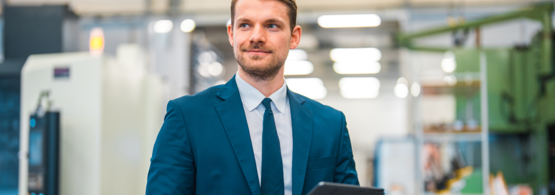 business man with tablet in manufacturing